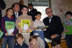 Children receiving an album of the Armenian version of Tintin